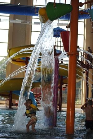 Children playing and having fun in the leisure pool area.